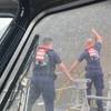 A Coast Guard boat crew attempts to throw a hammer at the hull of the Seacor Power in an attempt to make contact with potential survivors inside the vessel. (U.S. Coast Guard photo courtesy of Coast Guard Station Grand Isle)