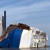 A crane positions the 16th and final lifting lug onto the Golden Ray hull in St. Simons Sound, Ga. (Photo: St. Simons Sound Incident Response)
