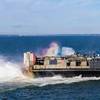 A landing craft air cushion assigned to Assault Craft Unit 4, exits the well deck of the San Antonio-class amphibious transport dock USS San Antonio (LPD 17) while in port. Photo by US Navy/Savannah Hardesty