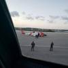 A U.S. Coast Guard helicopter crew walks an ailing mariner to an aircraft in Providenciales, Turks and Caicos, on Wednesday. The man was experiencing health complications aboard the tug Patriarch and needed higher level medical care. (U.S. Coast Guard photo)