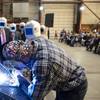 A welder authenticates the keel of LCS 27, the future USS Nantucket, by welding the initials of ship sponsor Polly Spencer. Pic: Lockheed Martin Nantucket