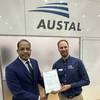 Antony M DSouza, President and Director Southeast Asia, Pacific and Indian Subcontinent, DNV and Sam Abbott, Head of Research and Development at Austal celebrate the Approval in Principle for the AROS Controller at INDO PACIFIC 2025. (image: Austal)