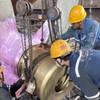 Eco Boos Cap being retrofitted in China. © EcoNavis