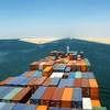 File Image: a boxship transits the suez Canal in better weather (CREDIT: © Andriy Kovach / AdobeStock)