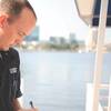 File Image: A USCG safety inspector at work on the waterfront. CREDIT USCG / Anthony Soto