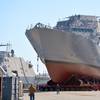 File photo: Littoral combat ship USS Indianapolis (LCS 17) is moved from an indoor production facility in Marinette, Wisc., to launchways in preparation for its upcoming launch into the Menomenee River. (U.S. Navy photo courtesy of Fincantieri Marinette Marine by Val Ihde)
