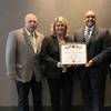 From left to right: Dennis Weaver, FMM AFSO/Security Coordinator; Jan Allman, FMM President and CEO; Nate Millsap, Director of Industrial Security; Francesco Valente, FMG President and CEO (Photo: Fincantieri Marinette Marine)