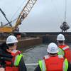 Left to right: MD Secretary of Transportation Gregory Slater, MD Governor Larry Hogan, and MPA-Port of Baltimore Executive Director William Doyle observe dredging operations at Seagirt Marine Terminal for a new 50-ft. berth in March 2021. (Photo: Maryland Port Administration)