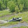 Metal Shark 21 Riverine equipped with Swamp Shark surface drive, shown powering through vegetation in Louisiana’s Atchafalaya Basin (Photo: Metal Shark)