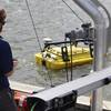 NOAA scientist operates an autonomous surface vehicle in the Port of Gulfport, Miss., during the Commander, Naval Meteorology and Oceanography Command’s Advanced Naval Technology Exercise on Nov. 6, 2019, to test and evaluate new maritime technologies. (CNMOC)
