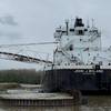 ohn J Boland discharging cargo from its port side using its self-unloading boom in Lorain, Ohio, after the grounding. (Source: NTSB)