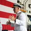 Rear Adm. Philip Sobeck (right) Commander of U.S. Military Sealift Command (MSC) explains the tradition of the Navy ‘looping ceremony’. Lt. Robert P. Ellison assumes the title of MSC's Flag Aide during the ceremony. The looping ceremony took place aboard USS Dwight D. Eisenhower (CVN 69) during MSC’s change of command ceremony held aboard the ship on Sept. 8, 2023. (U.S. Navy photograph by Brian Suriani/Released)