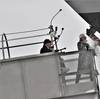 Ship sponsor Jill Donnelly breaks a bottle of champagne across the bow during the christening ceremony for the nation’s 17th Littoral Combat Ship, the future USS Indianapolis , at the Fincantieri Marinette Marine shipyard on April 14. Photo: Lockheed Martin