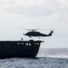 SOUTH CHINA SEA (May 7, 2019) An MH-60R Sea Hawk helicopter assigned to the "Easyriders" of Helicopter Maritime Strike Squadron (HSM) 37, Detachment 1, picks up pallets from the Military Sealift Command fleet replenishment oiler USNS Guadalupe (T-AO 200) during a replenishment-at-sea with the Arleigh Burke-class guided-missile destroyer USS Preble (DDG 88). Preble is deployed to the U.S 7th Fleet area of operations in support of security and stability in the Indo-Pacific region. (U.S. Navy photo