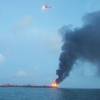 The U.S. Coast Guard responds to barge on fire approximately three miles from Port Aransas, Texas. (U.S. Coast Guard phot)