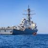 U.S. Marines and contractors, assigned to the Special Missions Branch, III Expeditionary Operations Training Group prepare to board the Arleigh Burke-class guided missile destroyer USS Higgins (DDG 76), during a visit, board, search and seizure exercise in the Philippine Sea, Okinawa, Japan, April 24, 2025. VBSS is part of the maritime interception operations that aim to delay, disrupt, or destroy enemy forces or supplies in the maritime domain. (U.S. Marine Corps photo by Cpl. Kira Ducato)