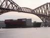 11,300t section of HMS Queen Elizabeth passing under the Forth Bridge as it nears the end of the journey to Fife