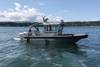 24 Workskiff M Series multi-mission vessel with walk around pilot house for the Tulalip Indian Fish and Game Agency for fisheries management, law enforcement, search and rescue and fire fighting. Naval architecture and marine engineering by Boksa Marine Design.