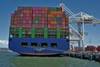 A boxship discharges cargo at the Port of Oakland (c) Port of Oakland