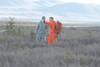A Canadian search-and-rescue technician points out the causality collection point to a soldier role-playing a wounded crash victim at Donnelly Training Area, Alaska, Oct. 30, 2013. The soldier is part of a Joint Task Force Alaska, Alaska National Guard, U.S. Army Alaska, Canadian Joint Operations Command arctic search-and-rescue exercise at Fort Greeley and Joint Base Elmendorf-Richardson, Alaska. U.S. Army photo