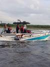 A Coast Guard Station Mayport boatcrew and good Samaritans rescue three people from the water April 23, 2018, after their vessel capsized near Blount Island in Jacksonville, Florida.(U.S. Coast Guard photo courtesy of Coast Guard Station Mayport)