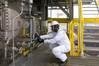 A DNV GL HazMat Expert doing a visual check for pipe gasket sampling. Photo DNV GL