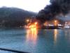 A fire burns at Delong Dock after an explosion on fixed barge in Whittier, Alaska, July 8, 2019. In addition to Coast Guard crews, response efforts included members of the Whittier Fire Department, Whittier Police Department, Anton Anderson Memorial Tunnel Fire Department and Girdwood Fire Department. Photo courtesy of Coast Guard Sector Anchorage.
