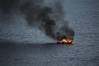 A fire destroys a fishing boat in the Atlantic Ocean about 90 miles off the coast of Florida. (U.S. Navy photo by William Spears)