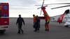 A man suffering from a head injury walks toward an ambulance after being medevaced from a South Korean icebreaker by a Coast Guard MH-60 Jayhawk helicopter crew to Barrow, Alaska, Aug. 20, 2014. (USCG photo)