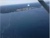 A sheen is visible from the air in Lake Ontario near the Fitzpatrick Nuclear Power Plant in Scriba, New York, approximately 10 miles northeast of Oswego, New York, June 26, 2016. A Coast Guard Auxiliary air crew noticed the sheen during a flight and reported it to Coast Guard Sector Buffalo. (U.S. Coast Guard photo)