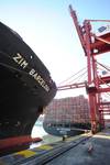 A Zim Boxship alongside and working cargo. (Credit: Zim)