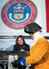 Annie Mabus chalked her initials into the keel of the nuclear submarine Colorado, which were then welded by Electric Boat employee John Alves (Photo courtesy of General Dynamics)
