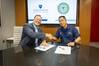 APL Assistant Director Tim Galpin and U.S. Coast Guard Research and Development Center commanding officer Capt. Michael Chien after signing a memorandum of understanding at APL on Aug. 5. The two institutions have teamed up to address critical technology challenges in national defense and maritime security. (Credit: Johns Hopkins APL/Craig Weiman)