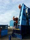 Aquatic's offshore team using harnesses and ladders to assemble modular reel drive system Photo Aquatic