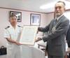Captain Gaku Hinata (left) receives the certificate of commendation from MOL Managing Executive Officer Takaaki Inoue.