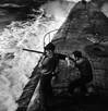 Crewmen firing 50 caliber machine gun on Batfish (SS-310) (U.S. Navy photo by Horace Bristol)