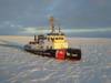 File photo: The US Coast Guard Cutter Katmai Bay, a 140-foot ice-breaking tug, escorts a motor vessel  through Lake Michigan near Lansing Shoal, in 2014. The cutter was operating as part of Operation Taconite, which is the icebreaking operation for the northern Great Lakes. (U.S. Coast Guard photo by Daniel R. Michelson)