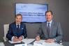 From left to right, MGM owner John Angelicoussis and Excelerate Managing Director and President Steven Kobos sign the agreement. Photo: Excelerate Energy