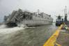 In 2014 the joint high-speed vessel USNS Spearhead (JHSV-1) maneuvers alongside the pier in Lagos, Nigeria. Spearhead took part in Obangame Express, a multinational at-sea exercise designed to improve cooperation among participating nations in order to increase counter-piracy capabilities. (U.S. Navy photo by Mass Communication Specialist Seaman Weston Jones/Released)