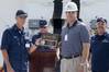 Ingalls Shipbuilding President Brian Cuccias (right) presents a ceremonial key to the National Security Cutter Hamilton (WMSL 753) to Rear Adm. Bruce D. Baffer, the U.S. Coast Guard’s assistant commandant for acquisition and chief acquisition officer, during a delivery ceremony. Also pictured is Capt. Douglas Fears (right), the ship’s prospective commanding officer. Photo by Andrew Young/HII