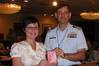 Jessica Dennis, regulatory compliance manager for Hornbeck Offshore, receives the first new consolidated Merchant Mariner Credential from Capt. David Stalfort, commanding officer of the National Maritime Center, during the Towing Safety Advisory Committee meeting held Thursday, May 7, 2009, at Dania Beach, Fla. (U.S. Coast Guard photo/U.S. Coast Guard)