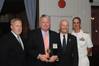 John Artzen, Chairman of the U.S. Merchant Marine Academy (USMMA) Alumni Association (far left), Rear Admiral Mark H. Buzby, USN, Ret., Maritime Administrator (third from left), and Rear Admiral James Helis, USMS, USMMA Superintendent (far right), present the Outstanding Professional Achievement Award to Robert Clyne, ABS Senior Vice President, General Counsel and Corporate Secretary. Photo: ABS