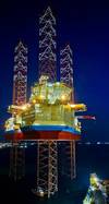 Maersk Intrepid at night: Image Maersk Drilling
