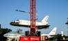 Mammoet lifts space shuttle replica Independence atop the original Shuttle Carrier Aircraft (SCA) NASA 905, a Boeing 747.