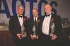 Matt Cox, Anthony Chiarello and Jim McKenna with their USS AOTOS statues.