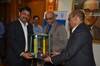 Neeraj Bansal, Chairman in-charge JNPT (left) receiving the Radiation Detection equipment from P. Sudhakar, CMD, ECIL (right) in the presence of Dr. R.K.Sinha Chairman, AEC and Secretary, DAE)