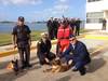 Rear Adm. Karl Schultz, commander of the 11th Coast Guard District, visits the Mexican Navy Second Naval Region’s K-9 unit where handlers demonstrated how the dogs carry out contraband detection Thursday, Dec. 5, 2013, in Ensenada, Mexico. The trip was in part of a joint two-day search and rescue exercise with members of the Mexican Navy. U.S. Coast Guard photo.