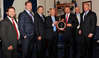 Rep. Bill Shuster is presented with the Champion of Maritime Award from the American Maritime Partnership.   L to R: Ben Billings, President, Offshore Marine Service Association; Stephen Martinko, Executive Director at Port of Pittsburgh Commission; Dave Grzebinski, President and CEO, Kirby Corporation; Thomas Allegretti, AMP Chairman and President and CEO American Waterways Operators; Rep. Bill Shuster; Barry Holliday, Executive Director for the Dredging Contractors of America; Matthew Paxton, 