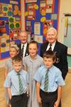 Residents from the Royal Alfred Seafarers’ Society Geoffrey Talbot and Roy Ticehurst [L-R] with pupils from St Anne’s Primary School in Banstead Emma Prichard, Rowan Stott, Katie Costello and Niall Cogavin [L-R]