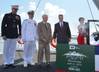 Ship Sponsor Bonnie Amos christens Portland (LPD 27), accompanied by (left to right) U.S. Marine Corps Maj. Gen. Christopher Owens, director of the U.S. Navy’s expeditionary warfare division; Capt. Jeremy Hill, prospective commanding officer, Portland; Ted Waller, a World War II veteran who served on the first USS Portland (CA 33); and Brian Cuccias, president of Ingalls Shipbuilding. Portland is the 11th LPD to be built by Ingalls. (Photo by Lance Davis/HII)